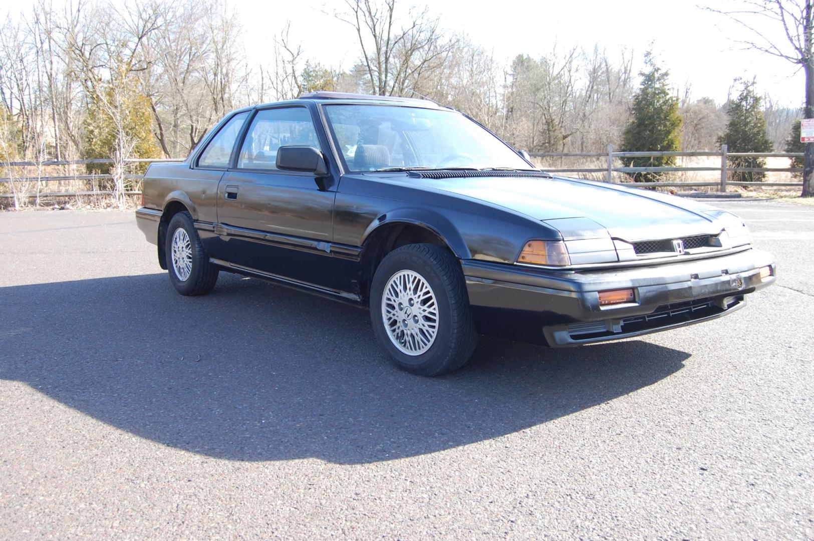 1987 Black /Gray Honda Prelude Si (JHMBA3248HC) with an 2.0L 4 cylinder engine, Automatic transmission, located at 6528 Lower York Road, New Hope, PA, 18938, (215) 862-9555, 40.358707, -74.977882 - Here we have a 1987 Honda Prelude SI with a 2.0L 4 cylinder putting power to the front wheels via an automatic transmission. Options include: gray cloth, power windows/locks/mirrors, AM/FM/TAPE radio, heat/AC, cruise control, tilt steering wheel, 13 inch alloy wheels, pop up headlights and a moon ro - Photo#0